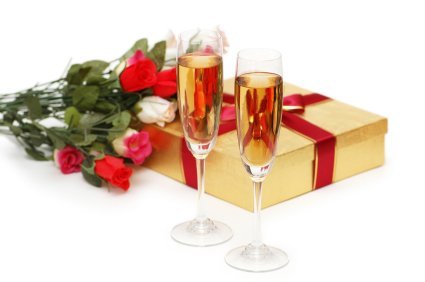 Giftboxes and champagne isolated on the white